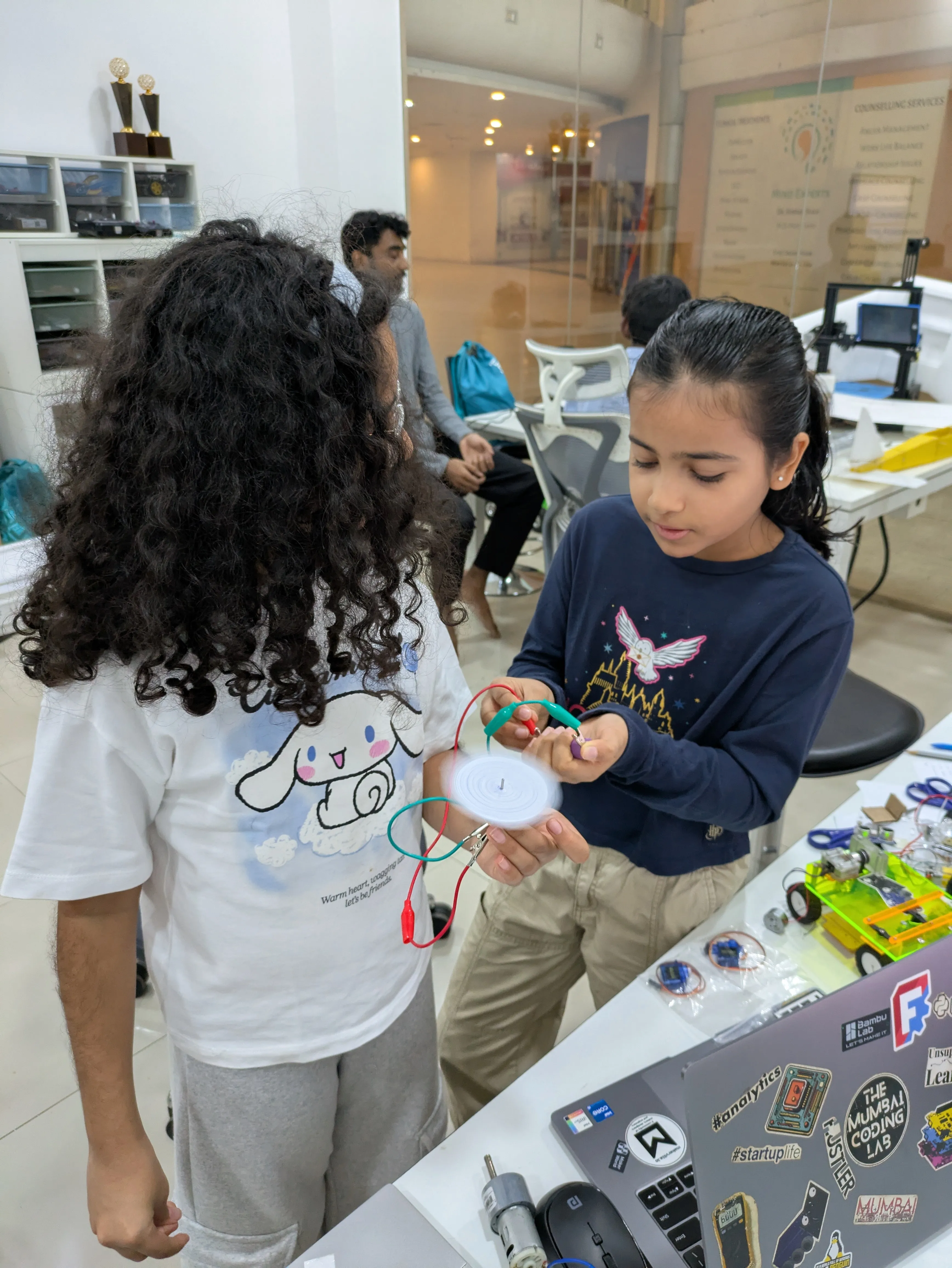 Kimaya and Divyana Learning about Motors